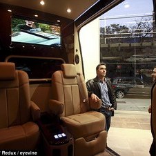 Driving commuters around the Benz: New York City's wealthiest enjoy hidden luxury in Mercedes vans that take up half the