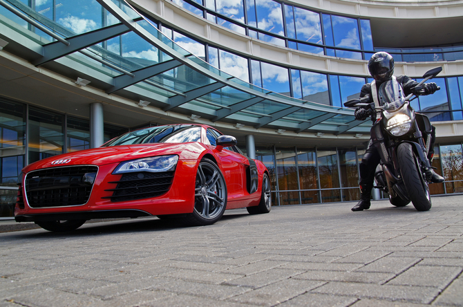 The image shows and Audi R8 and Ducati Diavel outside what appears to be the Audi headquarters