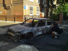 Cars being destroyed with London riots