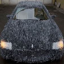 Maserati covered with 1,763 lbs of shattered glass