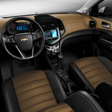 The interior gets a two-tone combination of black and tan with suede. 